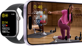 Apple Watch à côté d’un iPhone affichant une séance Apple Fitness+.
